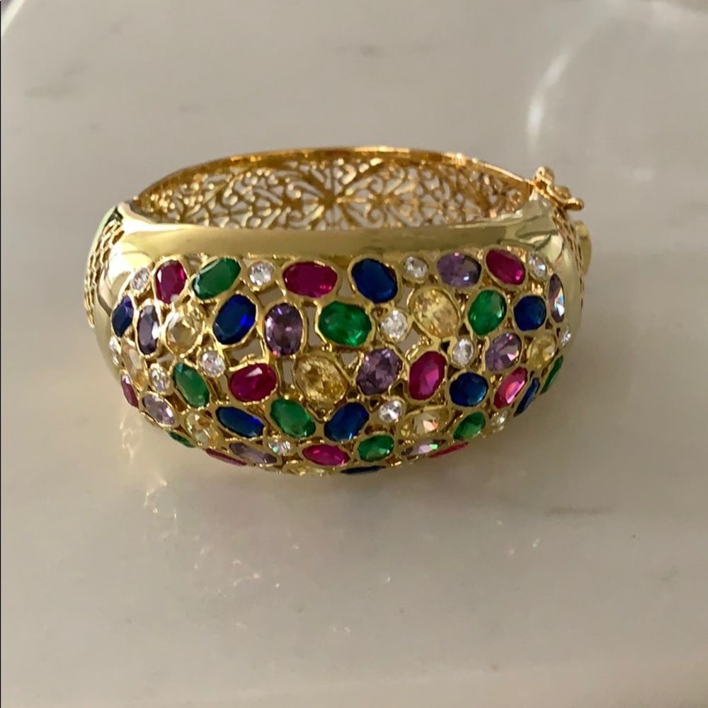 Gold bracelet with various stones. (Not real)